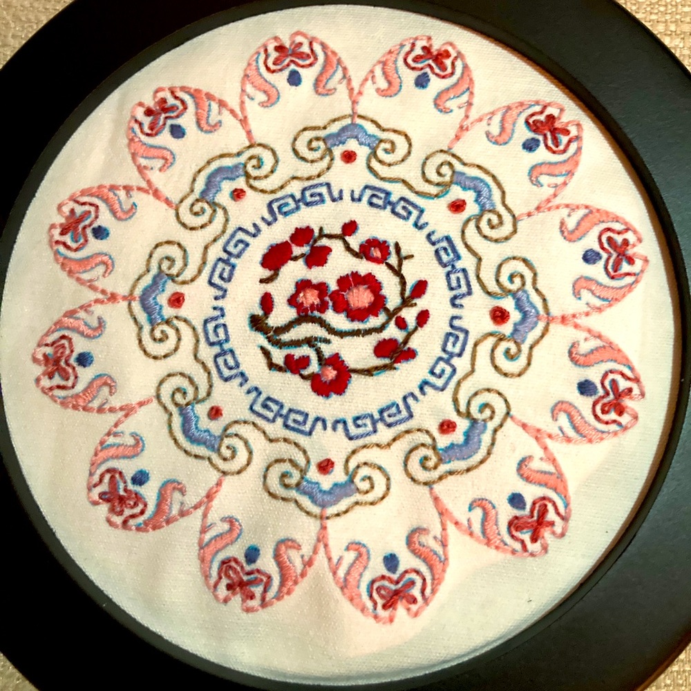 Hand embroidered flower mandala decoration.